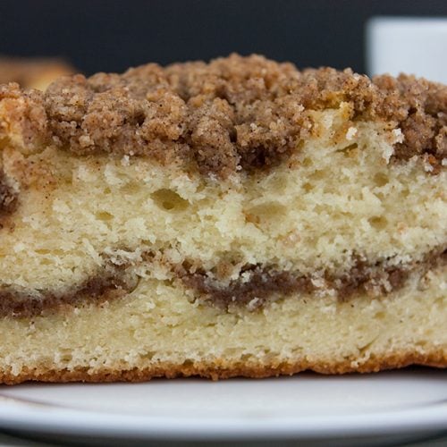 Cinnamon Crumb Coffee Cake on a white plate.