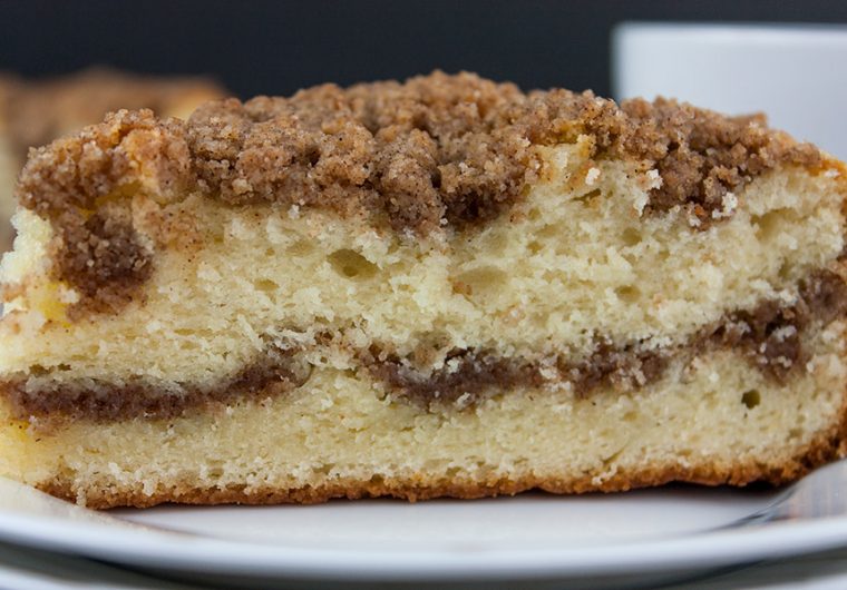 Cinnamon Crumb Coffee Cake - Moist, buttery cake ribboned with a gooey cinnamon middle and topped with a crumbly streusel. Nothing better than a thick slice of this cake with your morning or afternoon coffee.