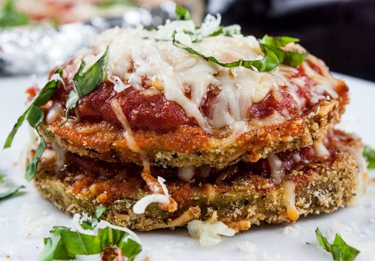 Sheet Pan Eggplant Parmesan - An easier and healthier version of an Italian classic. Crispy baked eggplant topped with tangy marinara sauce and smothered in creamy melted mozzarella cheese!