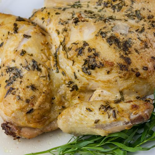Roasted Chicken with a Dijon Cream Sauce - Melt-in-your-mouth delicious! My take on the French Poulet à la Dijonnaise. Tender roasted chicken smothered in a creamy, tangy, tarragon sauce.