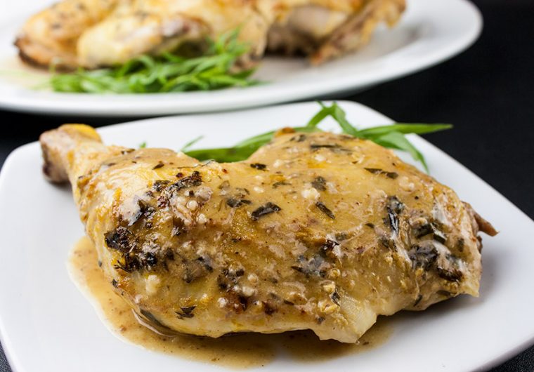 Roasted Chicken with a Dijon Cream Sauce - Melt-in-your-mouth delicious! My take on the French Poulet à la Dijonnaise. Tender roasted chicken smothered in a creamy, tangy, tarragon sauce.
