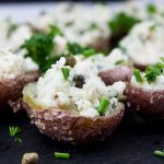 Deviled Potato Bites with a chive garnish.