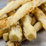 Puff Pastry Parmesan Cheese Straws - Flaky, puff pastry sprinkled with Parmesan Gruyere, garlic, and herbs! You just can't go wrong with this quick and easy appetizer!