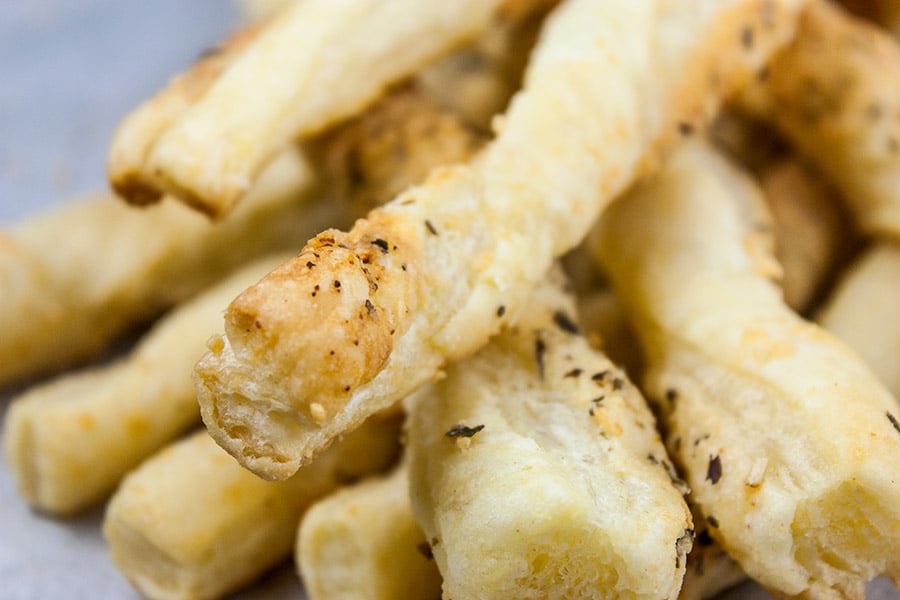 Puff Pastry Parmesan Cheese Straws stacked.