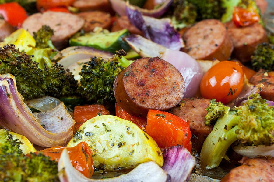 Sheet Pan Sausage and Vegetables mixed together.