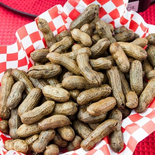 Slow Cooker Boiled Peanuts in a red basket.