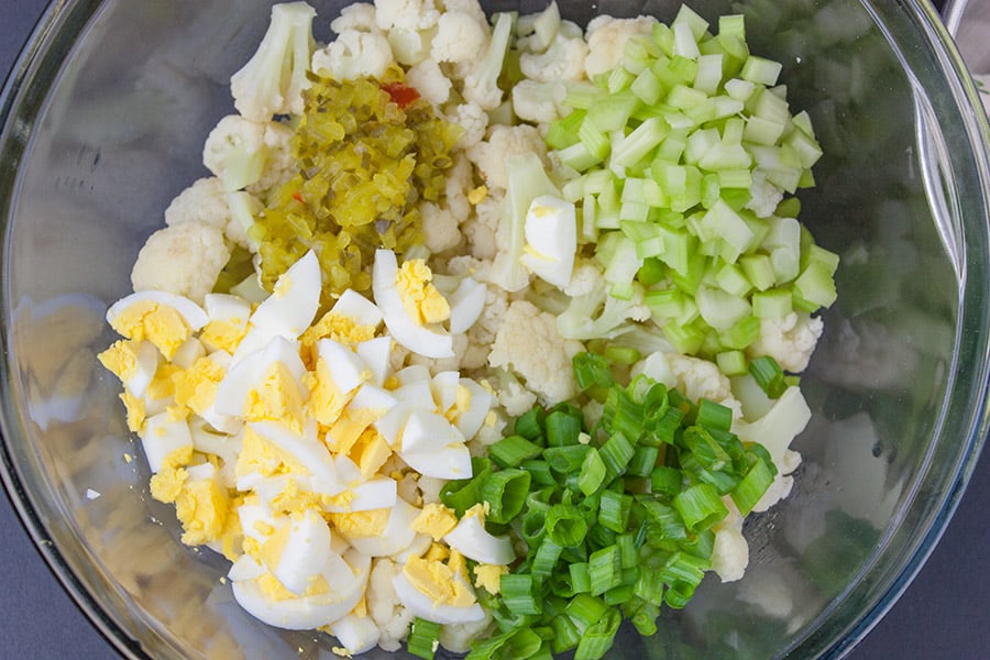 Cauliflower Mock Potato Salad - All the flavors of traditional potato salad but without all the carbs! Perfect for summer barbecues or any meal of the year. 