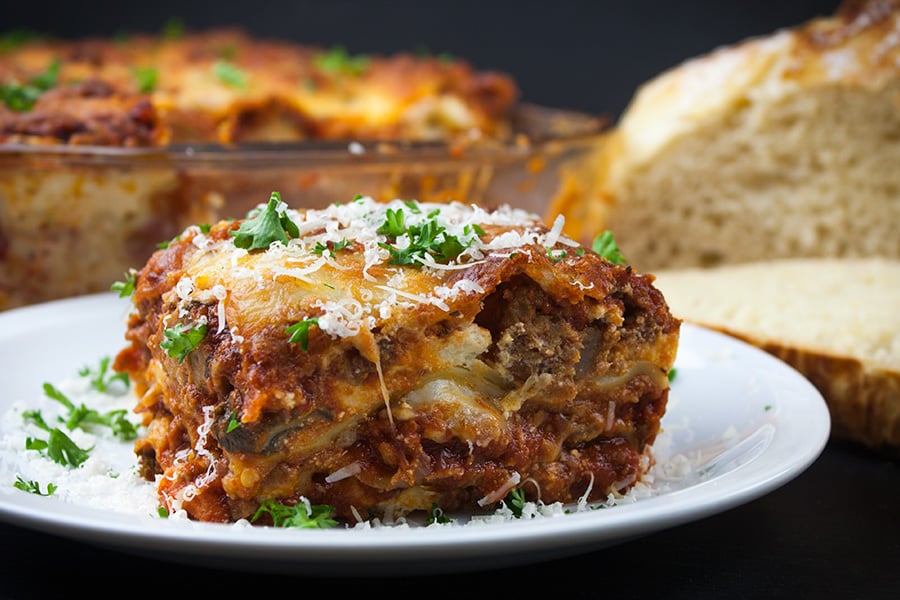 Absolute Best Ever Lasagna - The ultimate lasagna! Three layers of deliciously rich, luscious meat sauce, creamy cheesy ricotta and perfectly cooked noodles. With a trick to getting a perfect portion cut every time. 