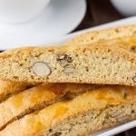 Almond Biscotti stacked on a white plate.