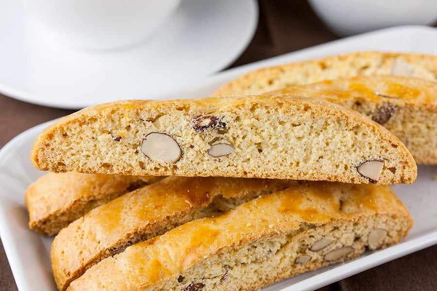 Almond Biscotti stacked on a white plate.