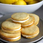 Lemon Sandwich Cookies - Tender, crunchy lemon shortbread cookies sandwiched with a zingy sweet lemon filling. Lemon lovers look no further!