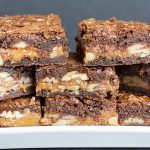Ultimate Turtle Brownies - Deliciously rich fudgy brownies oozing with creamy caramel and loaded with pecans! Easy to make and great for parties.