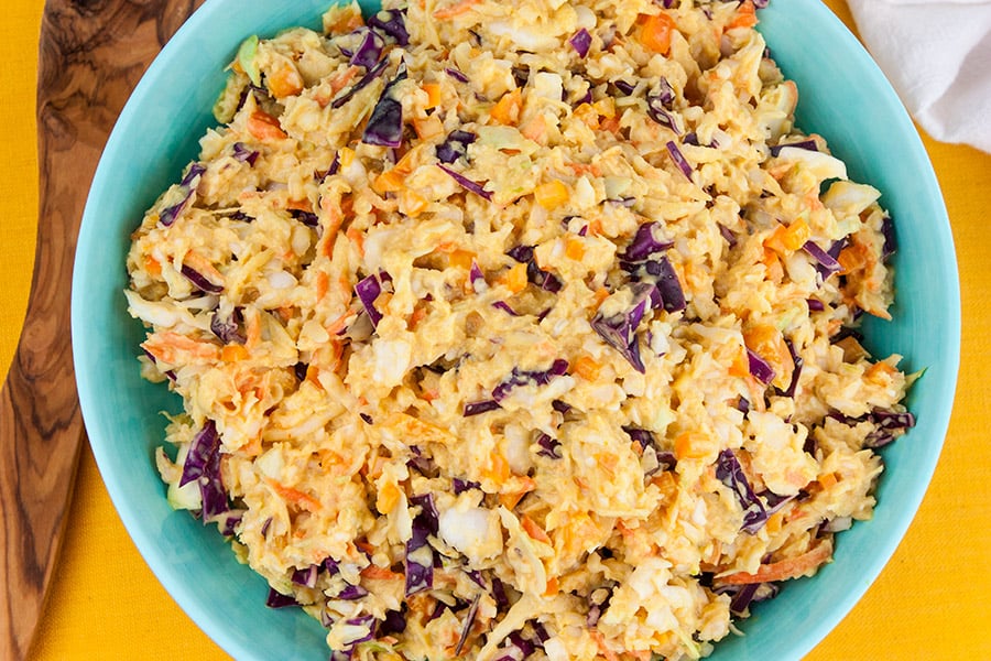 Tangy Southern Mustard Coleslaw in a blue bowl.