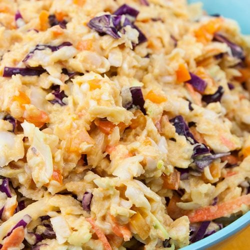 Tangy Southern Mustard Coleslaw in a large blue bowl.