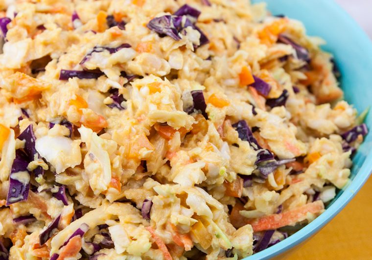 Tangy Southern Mustard Coleslaw - A complex flavor that's tangy, creamy, slightly sweet and spicy. Which makes it perfect for pulled pork or even better...slaw dogs!