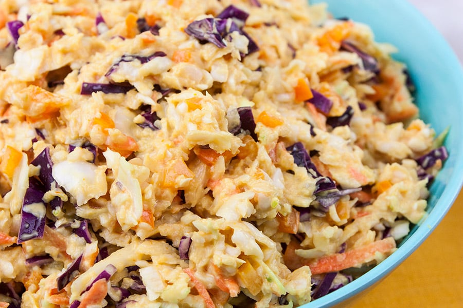 Tangy Southern Mustard Coleslaw in a large blue bowl.
