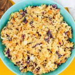 Tangy Southern Mustard Coleslaw - A complex flavor that's sweet, tangy, creamy, and slightly spicy. Which makes it perfect for pulled pork or even better...slaw dogs!