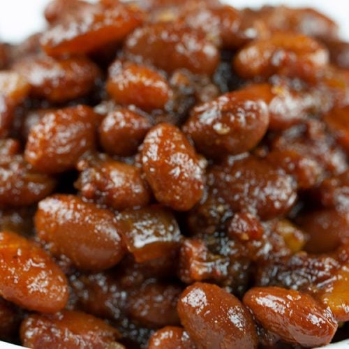 Slow Cooker Boston Baked Beans - Simmered in molasses makes these Boston Baked Beans dark, sweet and rich in flavor. Tastier than canned beans any day!