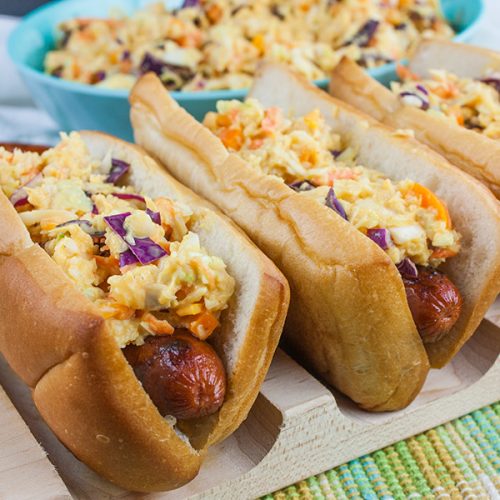Hot Dogs with Mustard Slaw - Great for barbecues but also for a quick weeknight dinner! Our tangy southern mustard coleslaw brings the perfect amount of mustard tang to the average hot dog.
