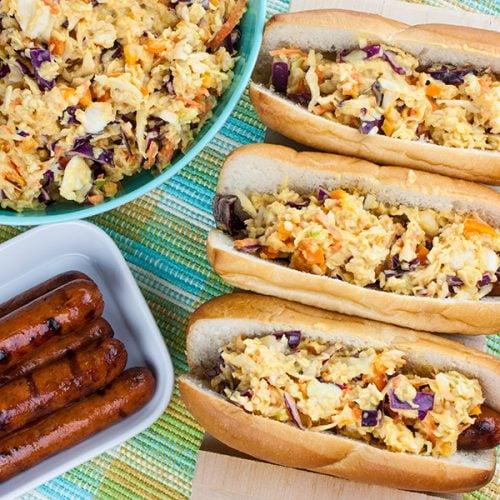 Hot Dogs with Mustard Slaw - Great for barbecues but also for a quick weeknight dinner! Our tangy southern mustard coleslaw brings the perfect amount of mustard tang to the average hot dog.