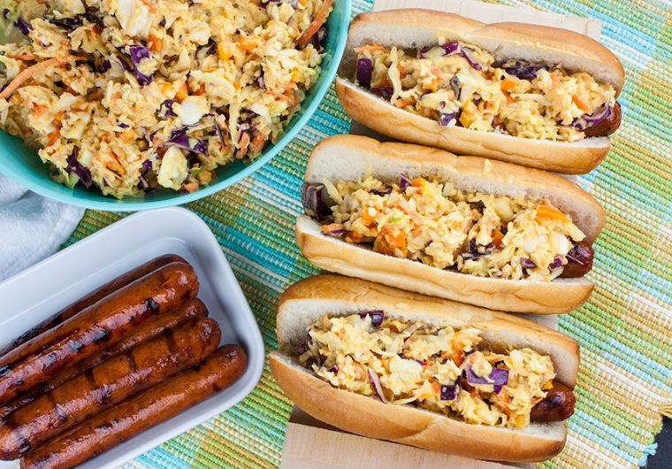 Hot Dogs with Mustard Slaw - Great for barbecues but also for a quick weeknight dinner! Our tangy southern mustard coleslaw brings the perfect amount of mustard tang to the average hot dog.