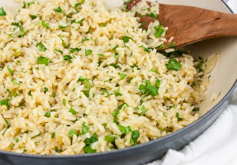 Cilantro Lime Rice - Perfect with any Mexican inspired menu! A few simple ingredients take boring white rice to a new flavor-packed level. A great side dish with pork, chicken, fish, or beef.