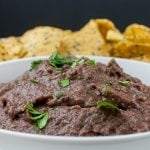 Easy Black Bean Dip - Ready in under 5 minutes. It's great for any party, gathering or just simple Taco Tuesday at home! A simple, creamy black bean dip packed with Southwestern flavor.
