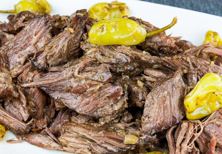 Crock Pot Mississippi Pot Roast - Five simple ingredients bring the perfect flavor combination to this juicy, tender pot roast. You're going to love this recipe!