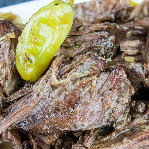 Crock Pot Mississippi Pot Roast - Five simple ingredients bring the perfect flavor combination to this juicy, tender pot roast. You're going to love this recipe!