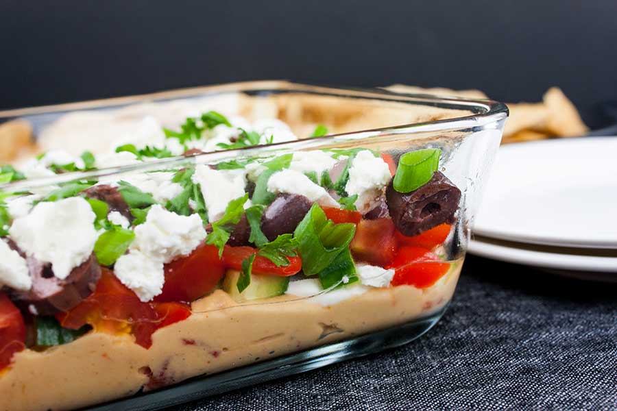 Easy Mediterranean Dip - side view of the serving dish showing the layers of dip