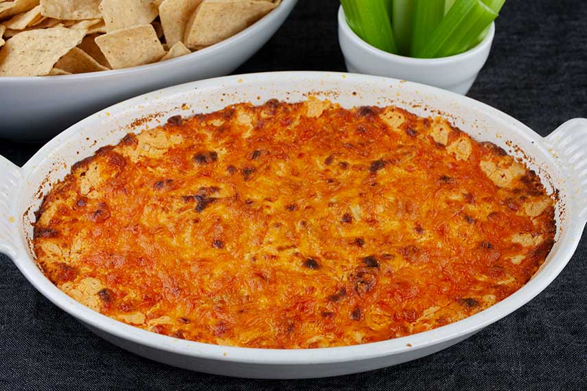 Buffalo Chicken Dish - baked dip in a white casserole dish