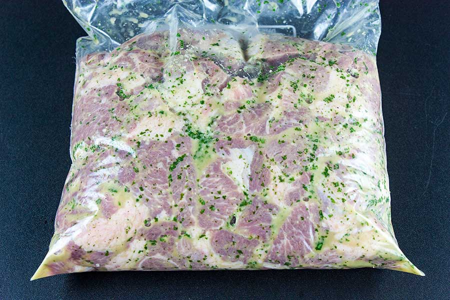 Meat and marinade in a zip lock bag.