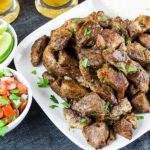 Crispy Pork Carnitas - Slow oven roasted marinated pork cubes with a crispy caramelized crust. Rich, moist, flavorful and so tender it melts in your mouth!