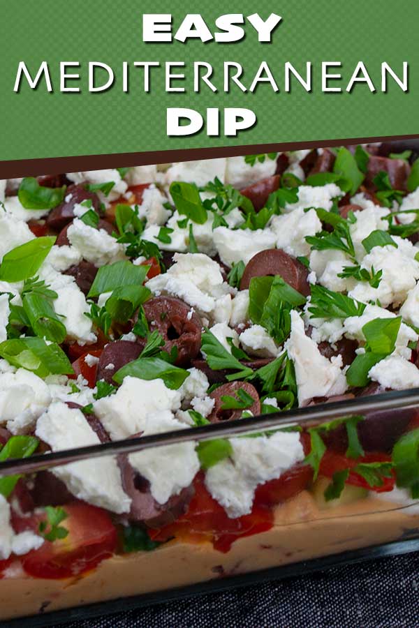 Easy Mediterranean Dip - Layered with hummus, sour cream, tomato, cucumber, roasted red pepper, feta cheese, Kalamata olives, and green onions. Perfect for any party or gathering! #appetizer #recipe #healthy #healthyrecipes