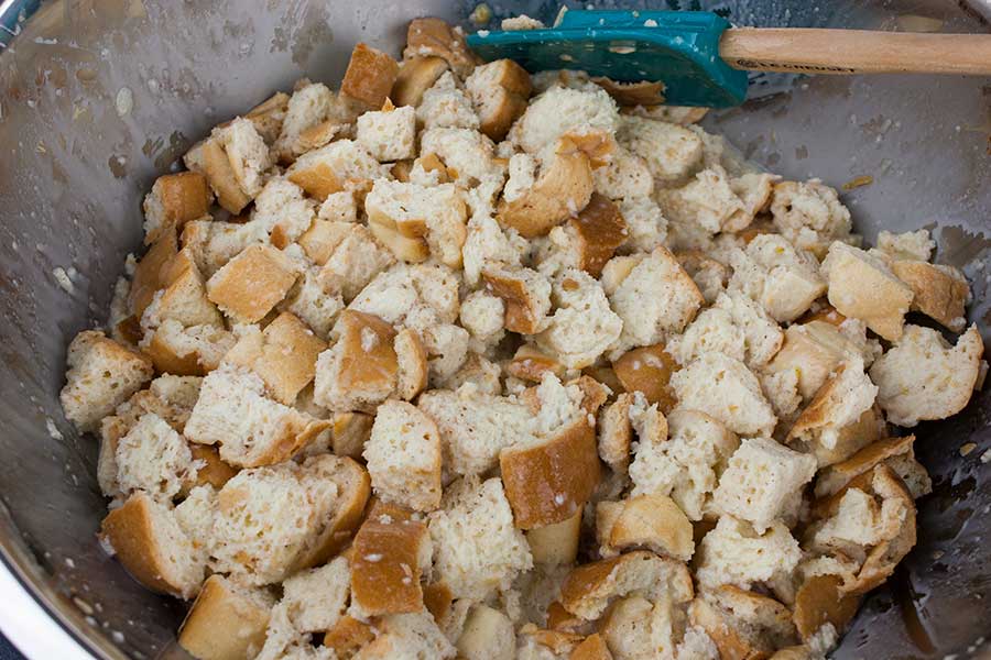 Egg mixture poured over bread cubes.