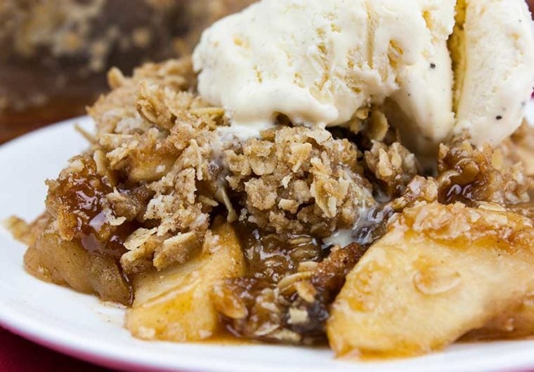 Classic Apple Crisp - Thinly sliced cinnamon-spiced apples baked to perfection and topped with a sweet crunchy oat crumble. Easy to make and a no-fuss way to apple pie flavors.