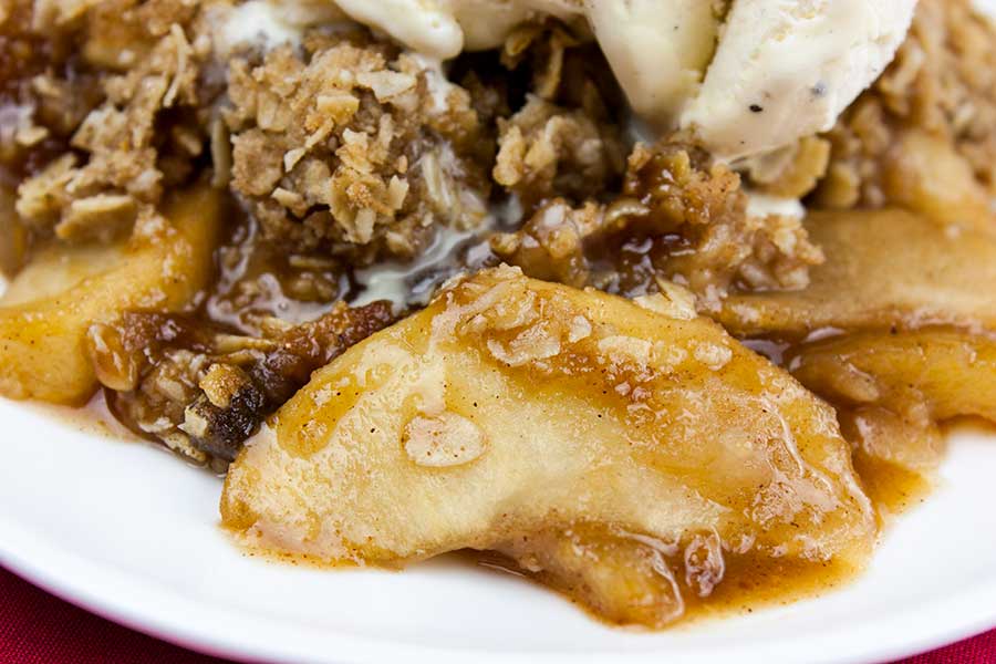 Apple crisp on a white plate.