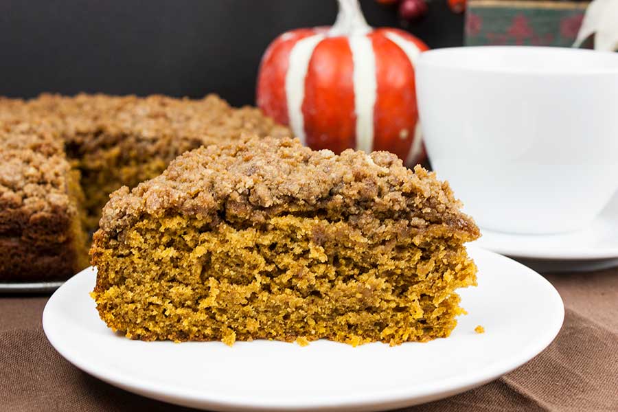 Slice of coffee cake on a white plate.