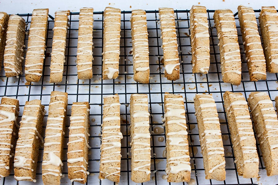 Spiced Apple Cider Biscotti - glazed biscotti drying on a wire rack