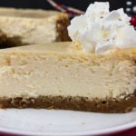 Eggnog Cheesecake with Gingersnap Crust - Thick, rich, creamy, and full of classic eggnog flavor! This recipe features the traditional warm spice flavors of the holidays. A perfect way to indulge during the season!