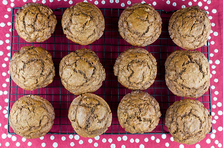 Gingerbread muffins on a wire rack.