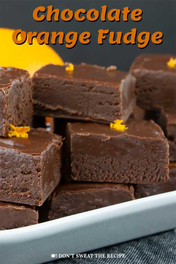 Chocolate Orange Fudge - Perfect holiday treat recipe. Thick, creamy, dark chocolate fudge kissed with fresh orange flavor. #christmas #candy #recipe #holiday#holidays #dessert