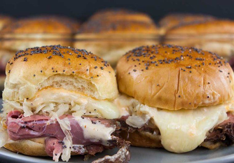 Pastrami And Swiss Cheese Sliders - This pastrami and swiss cheese slider recipe delivers all the flavors. It's perfect for any kind of get-together, movie night, or tailgate party.