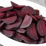 Ninja Foodi fresh beets in an oval white bowl.