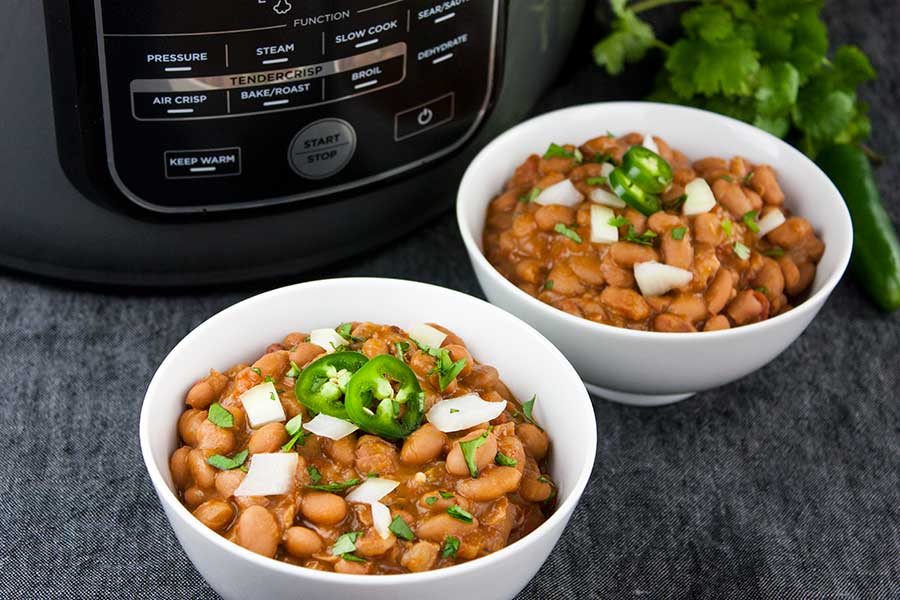 Ninja Foodi Mexican Pinto Beans (Charro Beans) - Such an easy recipe to spice up pinto beans. Perfect side dish to any Mexican meal! Hearty enough to be the main meal.