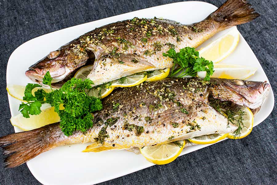 Baked Whole Red Snapper - Deliciously seasoned with citrus and herbs this red snapper recipe is on the table in minutes!
