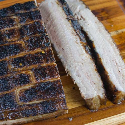 Step up your grill game by serving up some deliciously rendered down smoked pork belly. It's so rich and decadent, everybody will rave!