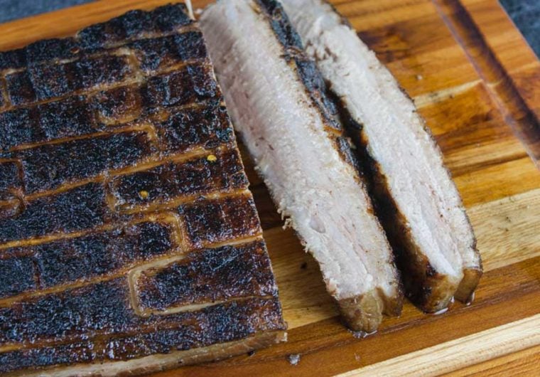 Step up your grill game by serving up some deliciously rendered down smoked pork belly. It's so rich and decadent, everybody will rave!