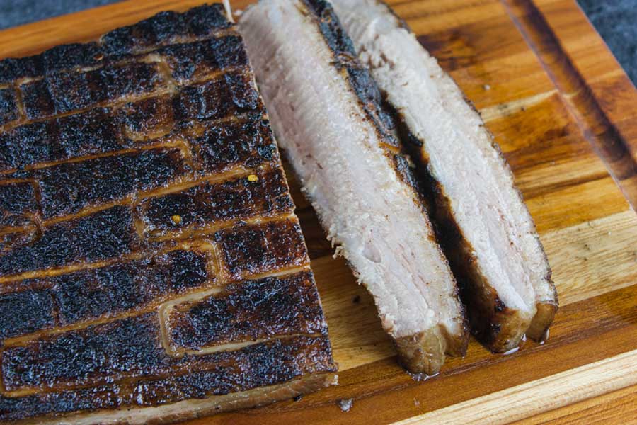Step up your grill game by serving up some deliciously rendered down smoked pork belly. It's so rich and decadent, everybody will rave!