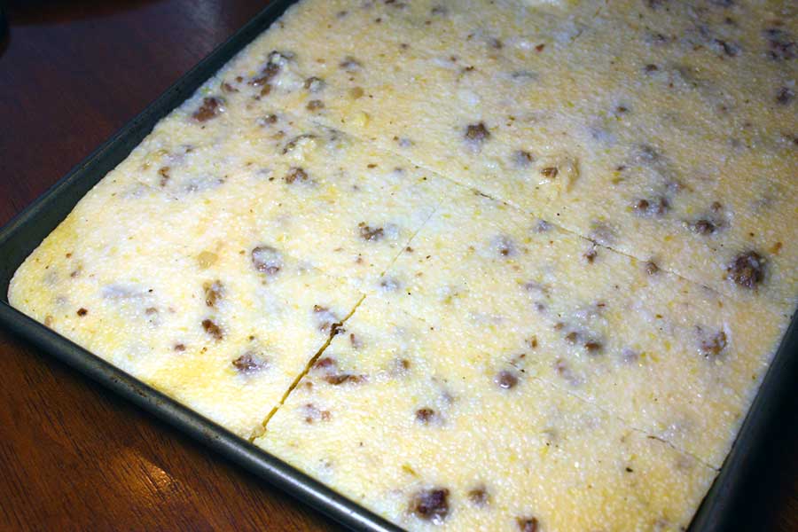 Fried Grit Cakes - chilled grit mixture in the sheet pan sliced